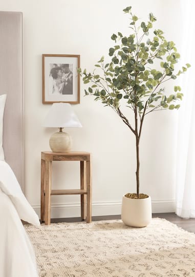 Kate and Laurel 6ft. Eudora Faux Eucalyptus Tree with Cream Planter